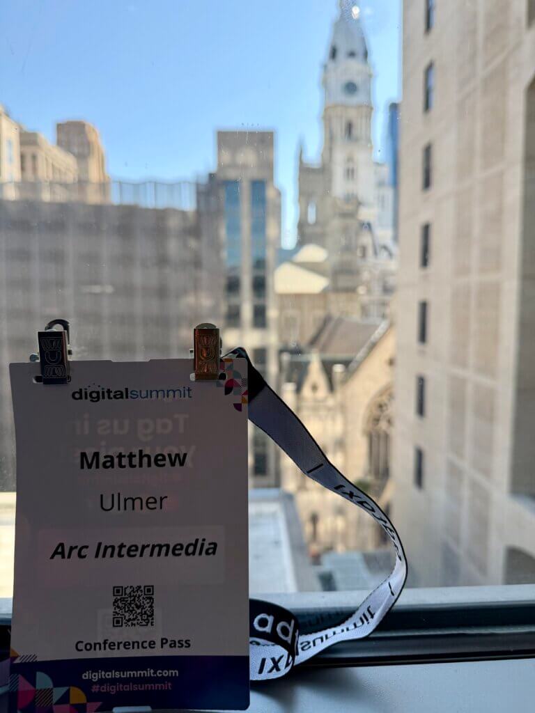 Conference badge in front of City Hall