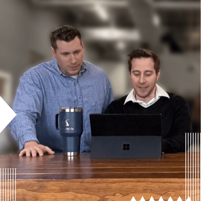 Mike and Matt reviewing projects together.